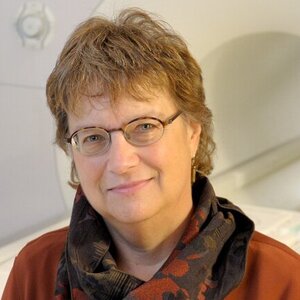 Head shot of Wendy Heller in front of an MRI machine